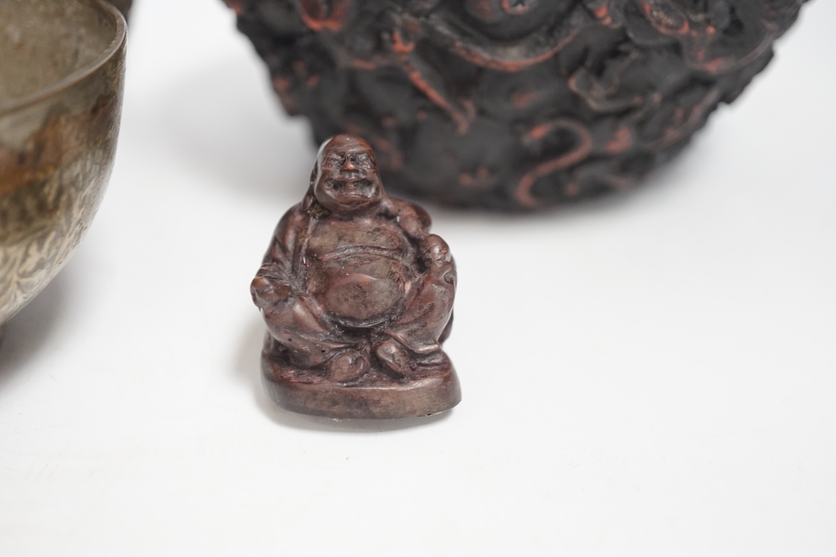 An Indian bronze bowl, two Chinese jars, 'dragon' bowl and a seated figure of Buddha, 15cm high